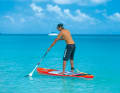 The legs are half bent and the abdominal muscles are tensed in preparation for the twist.