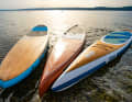The RRD Retro Wood GT 14'0'' x 28.3'' in the centre basks in the sun between Naish (left) and Siren (right)