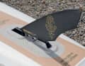 The Indiana Touring Race fin sits in the split fin box. This makes it easier to roll the board in.