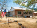 The American cliché - flag, pick-up, Starbucks - is complemented here only by the surfboards in the front garden