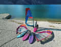 A comfortable freeride board with a camberless sail is the starting position. Faster boards, sails and fins are available for upgrading.