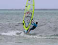 The higher speed when planing also increases the perceived wind (relative wind), so you can then switch back to a half-wind or even close-hauled course without losing your glide.