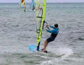 In the approach position, you are hooked into the trapeze, with your front foot on the deck, turned in the direction of travel