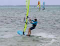 As your board starts to glide, bear away slightly to leeward, onto a light broad reach