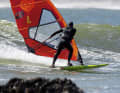 By veering to windward and simultaneously pulling the sail in, you’ll quickly find yourself leaning into the inside of the turn in the blink of an eye.