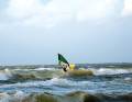 A westerly wind is driving the surf onto the beach here