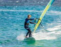 You initiate a leeward turn by moving the back foot out of the strap towards the leeward edge