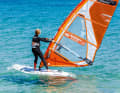 You will immediately feel your board change direction towards the wind. Place your front foot in front of the mast shortly after initiating luffing.