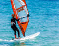 Now pull your front foot back towards the daggerboard, you are now standing with both feet parallel and in the direction of travel, the sail is levelled in front of you and feels light. The most difficult part is now behind you.