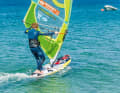 Ride a basic jibe and change the foot position to downwind as usual
