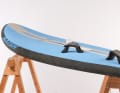 The entire deck is covered with a comfortable EVA pad. The bow is properly raised, so the board slides well over choppy waves even when not planing.