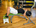 Bench press: Grip the barbell well above shoulder width and then slowly lower it to your chest.