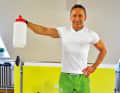 Lift a canister filled with water sideways upwards...