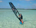 2-3) Luff up until the board is upwind and push the sail forwards towards the bow like a heli tack - it hits back, the board turns out of the wind. The following position (3) is similar to that after a duck in regular stance, which you need for moves such as the Culo. Twist your upper body and hips and hold the sail open with your back hand to avoid being pushed downwind by the board.