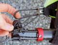Insert the extension and hook the black rope loosely into the trim roll