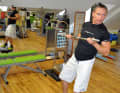 Take a pole - this simulates your boom - and then: Let's go indoor surfing. Keep pulling the pole towards your chest ...