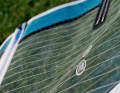 The correct luff tension For all current sails and sails up to ten years old, the leech (trailing edge) must be slippery in the upper area on land. This is achieved by applying a lot of tension to the luff extrusion (bottom). In most cases, these creases run between the second and third battens from the top to about the centre of the sail. The sail may also still slip while sailing. Sails with a tight leech (too little tension) do not go fast, are difficult to control and feel heavy. Tip: You cannot destroy the sail or mast with manual force alone, without a crank. So don't be afraid and keep it trimmed! The VTS (Visual Trim System) on all North sails stands for nothing more than printed dots. These indicate how far the creases must run into the sail. Simply tighten the bottom of the sail until the creases reach the desired point (MIN for light winds, MAX for strong winds) - and you're done!
