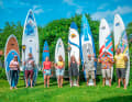 All in the Mistral look - Ernstfried Prade (3rd from left) with his family and his board creations. Many windsurf boards were followed by numerous SUP boards.