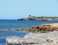 Funtana Meiga on a calm day. As soon as the mistral whistles, great waves roll into the bay.