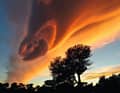 Mistral gusts threaten on the east coast of Corsica, when conspicuously stacked lenses of clouds with an oval outline form in the sky.