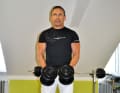 ...and then lower it again. Make sure that you don't bungle with your upper body and gain momentum.