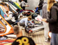 Hustle and bustle in the material tent: sticking sails...