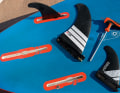 Starboard uses a US box for the centre fin, the side fins sit in the "Starbox". This has the same dimensions as the slot box, but the side fins engage with the notch in a holder at the front of the box and only require an additional screw at the rear.