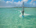 Tip: Actively apply pressure to the windward edge; as you start the ‘duck’, carve slightly into the wind and try to tilt the mast a little more to windward, towards the water. | Photo: True media & culture