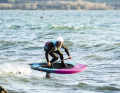 Surfing wind waves on the lakes is Balz Müller's great new passion. Here with his new signature downwind board "The Waltz".