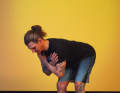 Bend forwards slowly, keeping your back straight and your chest proud