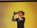 Breathe in and bring the band back in front of you before you start the next push forwards (1). This sequence should be seen as a movement and repetition.  Ten repetitions over two to three sets will make your shoulders burn.  Alternatively, you can also perform the exercise with a knotted towel.
