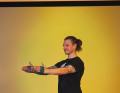 Place a loop band around your hands.  Tighten the band and move your hands as far apart as possible.  Now stretch your arms forwards and hold against the resistance exerted by the band on the back of your hands. Breathe out as you stretch.