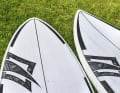 Performance wave boards such as the Naish Hookipa Quad (right) usually have much narrower nose and tail sections than wave all-rounders.
