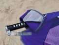 The mast protector can be easily folded up high, with a pocket for the rope.
