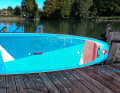 The deck pad extends far forward of the centre of the board and to the tail.