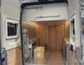 1. windsurfers who don't want to constantly hoist their equipment onto the roof of the vehicle need sufficient storage space under the bed in the van.