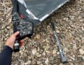 Ideally, the extended line should be within easy reach, so that a half-hoisted sail makes as little contact with the ground as possible and does not flap in the wind for long.
