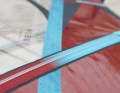 A rubber strip is glued to the bottom batten to prevent abrasion of the non skid paint when water starting