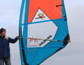 The outline of the sail is characterised by a short luff length and long boom length