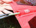 Use long, pointed pliers to pull out the end of the batten