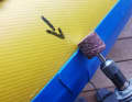 The edge is carefully sanded flat. Take care to sand as little as possible into the surrounding tissue.