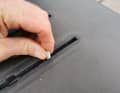 The first step is to screw the stud bolts into the track nuts in the rail