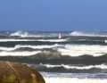 Even further to windward, official waves rolled in
