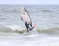 The High Five: The breaking wave’s crest strikes the underside of the board