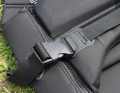 The hook is secured with a wide webbing strap