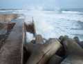 Many stretches of coastline are protected against tsunamis by massive structures, making it difficult to land