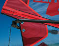 Most sails have a choice of two eyelets on the clew. Threaded into the upper eyelet, a sail gets a little more power, the lower eyelet is chosen for strong winds and more control. The selection also offers some leeway for riders of different sizes.