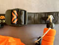 The release and leash are attached to the waist belt instead of being permanently connected. This means that the system can also be used on harnesses or other hip belts
