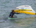 ...the free rear one immediately reaches under the wing to the first handle loop