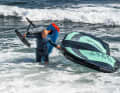 When landing, you should get off in good time and carefully push the board into shallower water. The board is then shouldered again in waist-deep water